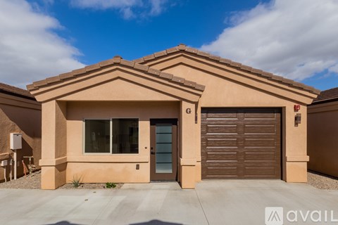 A house with a brown garage door and a blue door.
