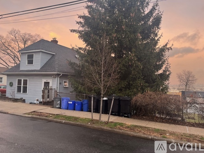 A house with a tree in front of it.