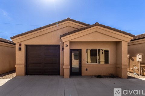 A house with a brown garage door and a blue door is available for rent.