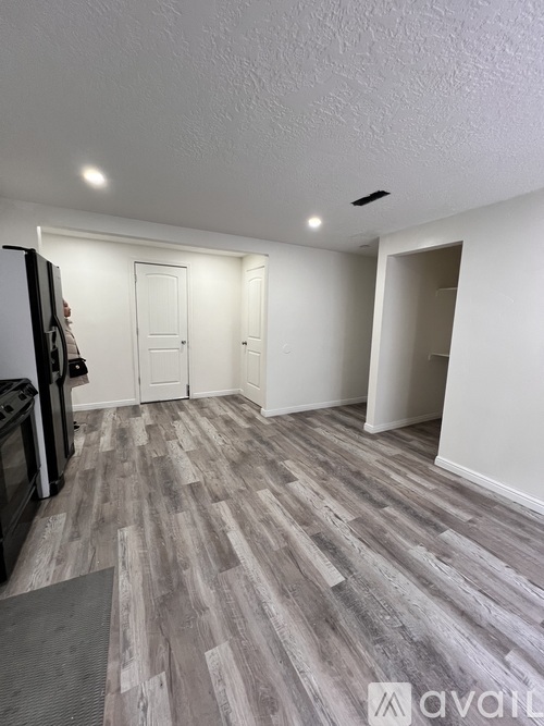 A room with a grey floor and white walls.
