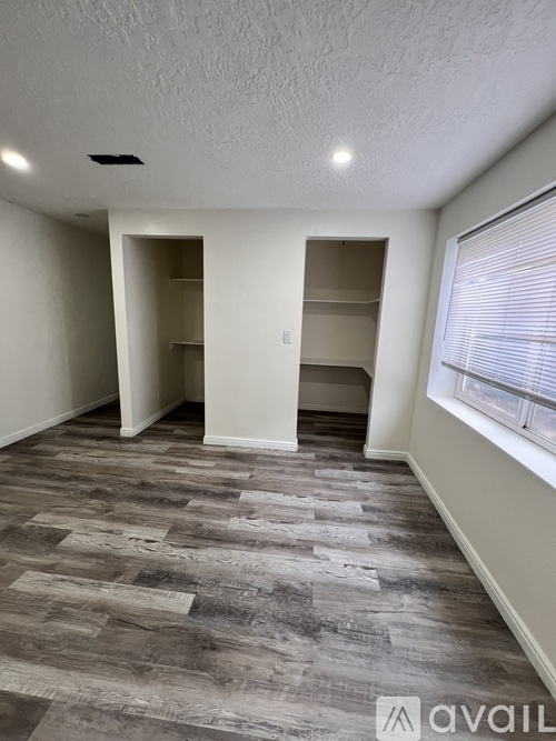A room with a grey floor and white walls.