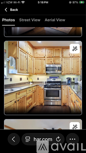 A kitchen with wooden cabinets and stainless steel appliances.
