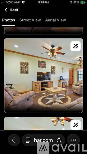A living room with a brown sofa and a coffee table.