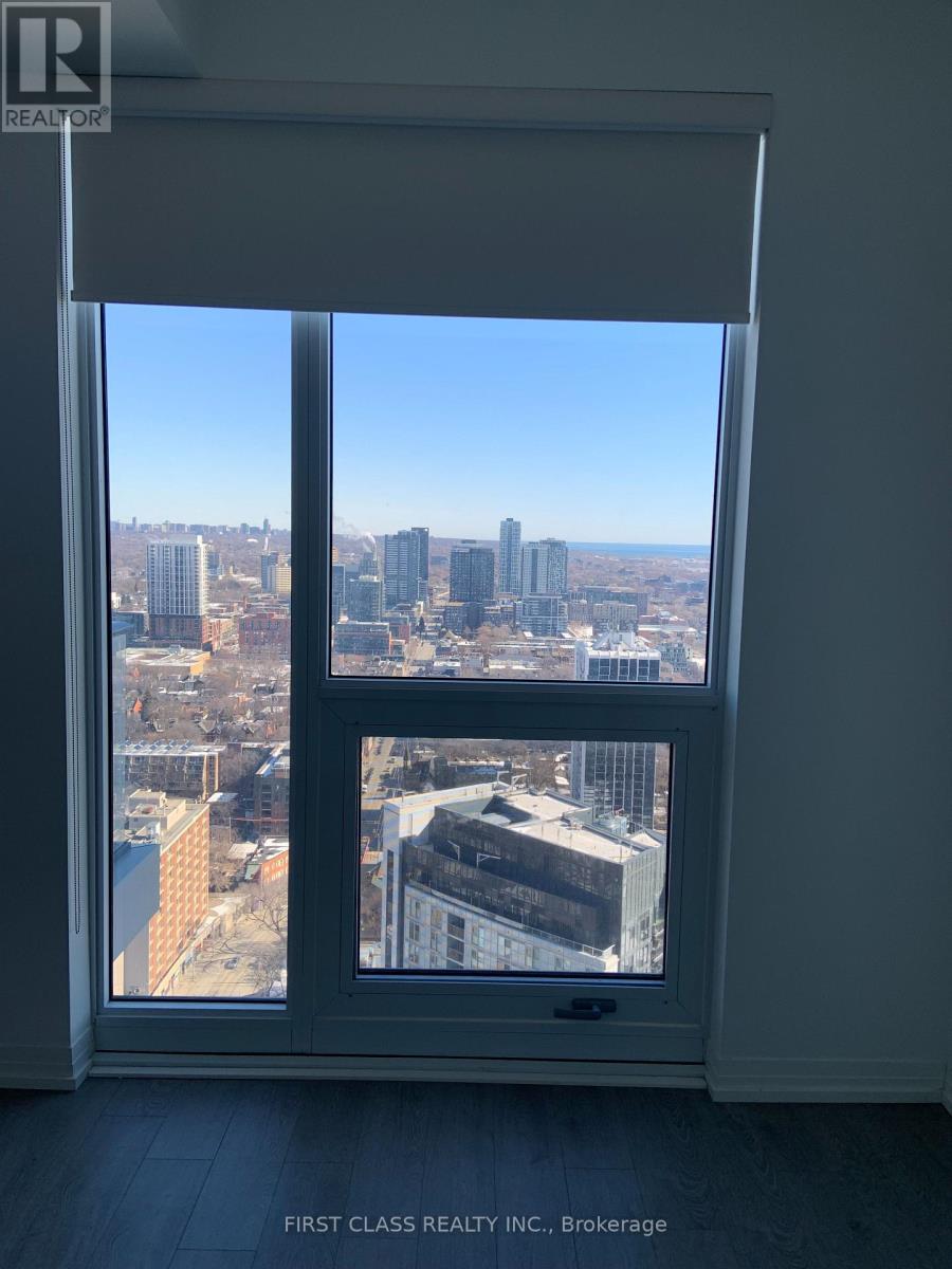 A view of a cityscape from a window in a room.