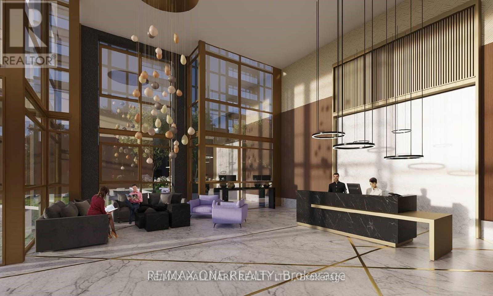 A modern office lobby with a reception desk and seating area.