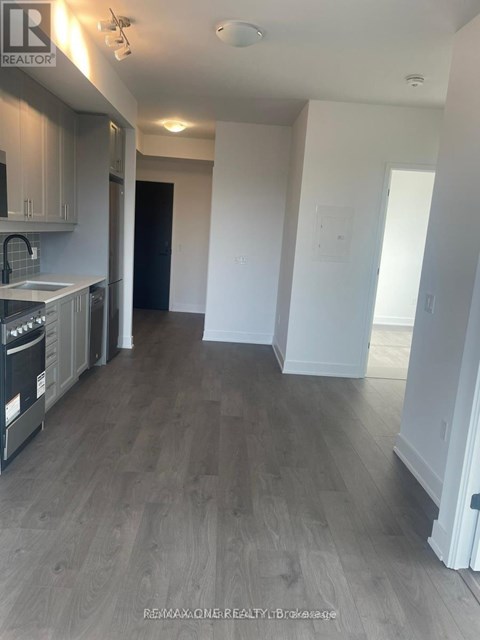 A realtor photo of a kitchen with a dishwasher and a refrigerator.