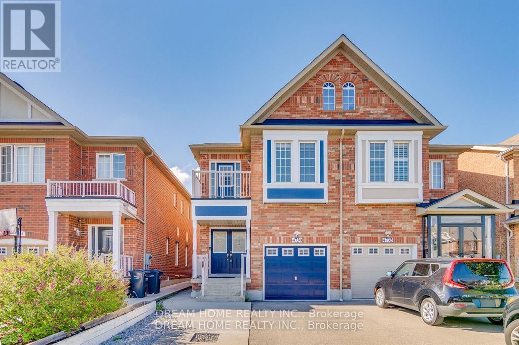 A house with a car parked in front of it.