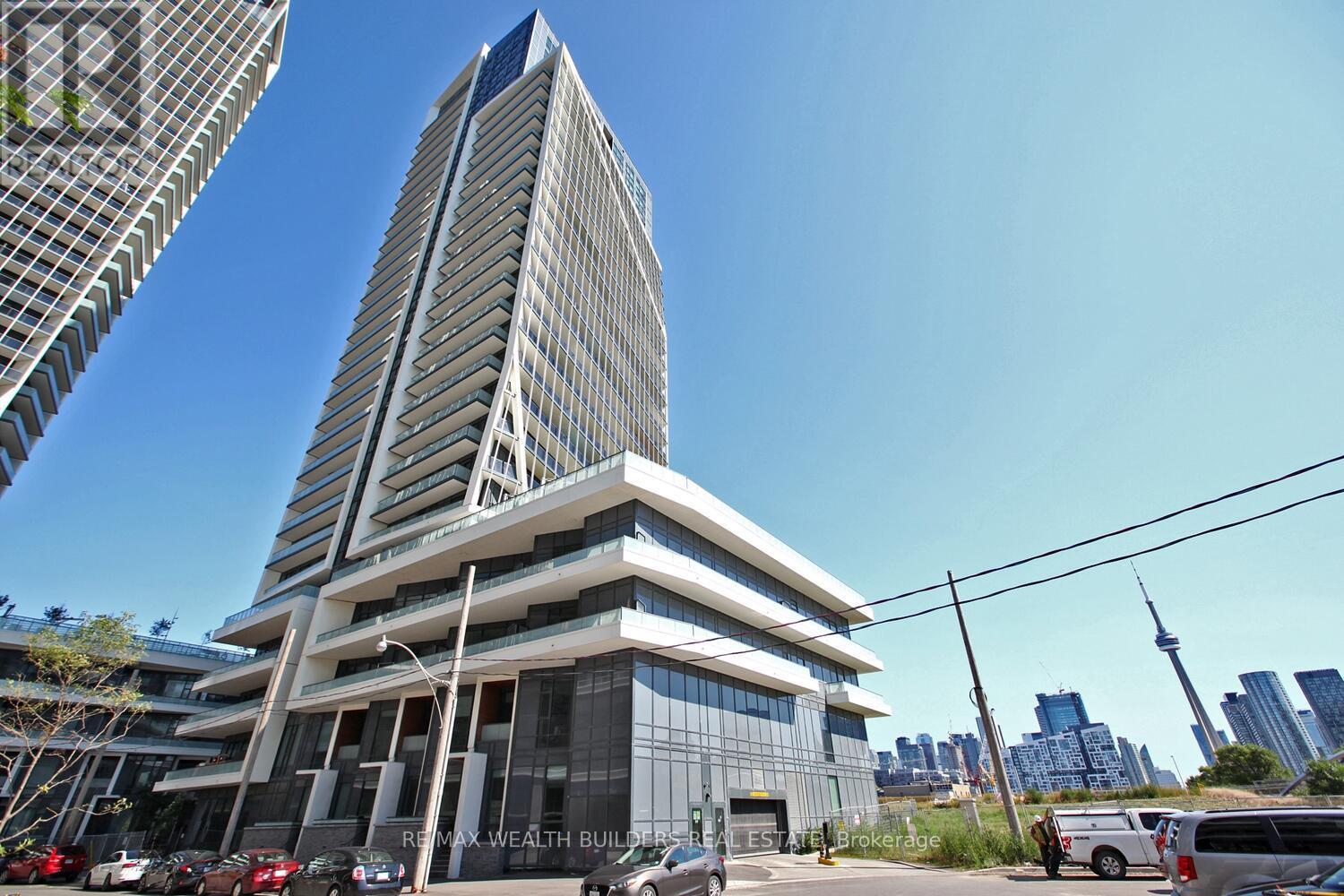 A tall building with the words "Real Wealth Builder" on it.