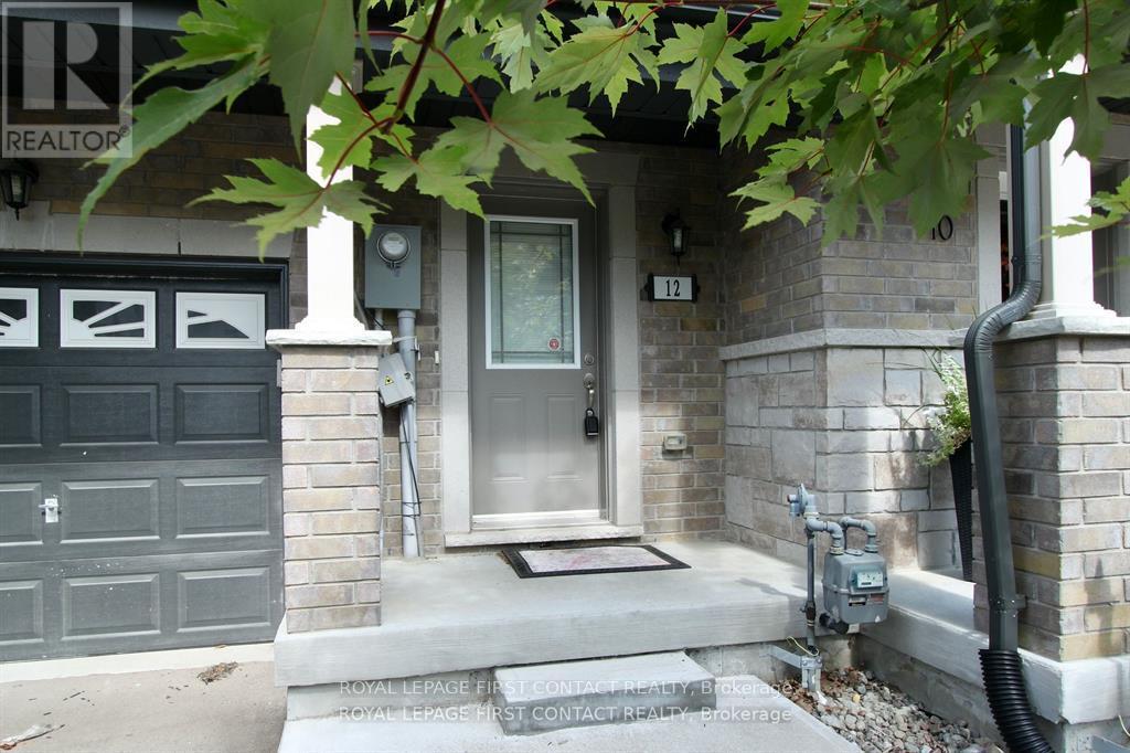 A house with a grey front door and a sign that says REALTOR.