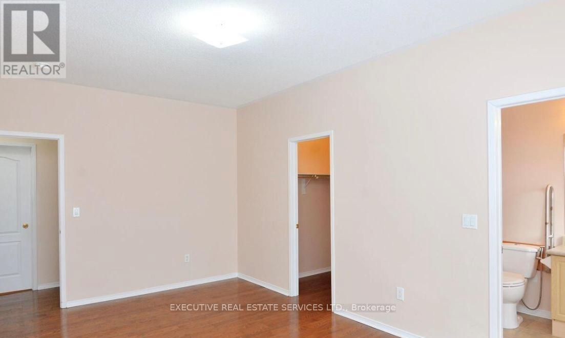 A room with a doorway leading to another room.