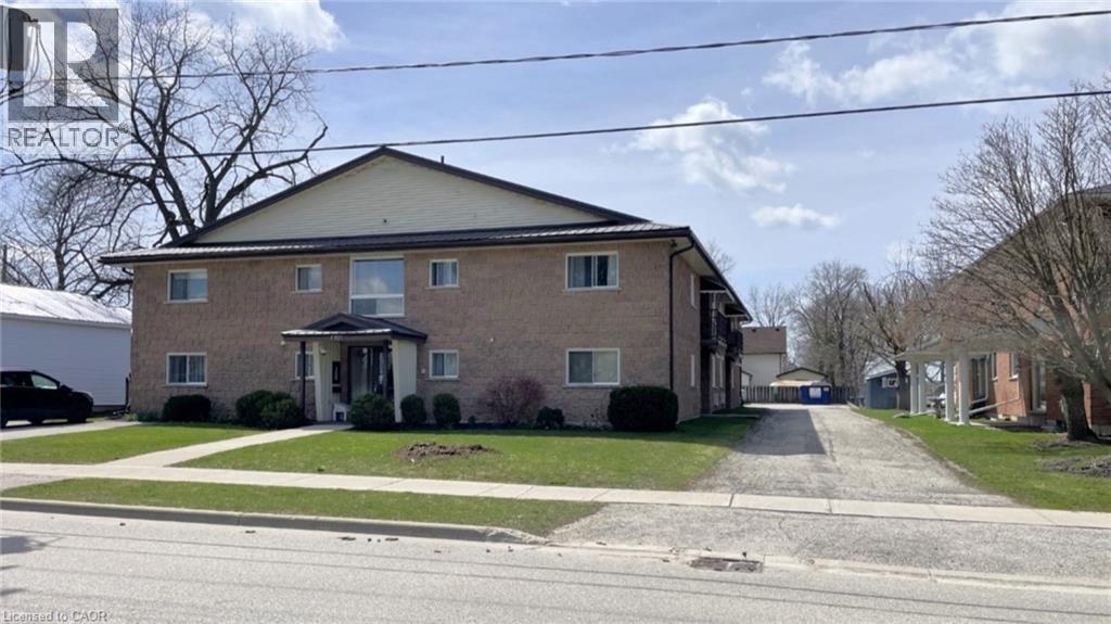 A house with a driveway in front of it.