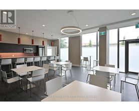 A modern dining area with white tables and chairs.