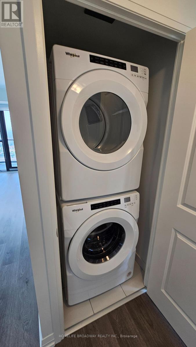 A white washer and dryer in a cabinet.