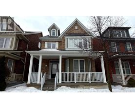 A house with a porch and a sign that says "REALTOR".