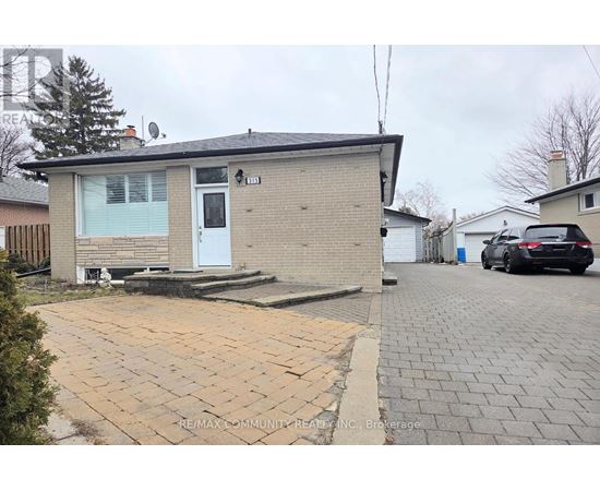 A house with a driveway in front of it.