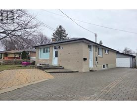 A house with a driveway in front of it.