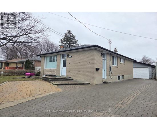A house with a driveway in front of it.
