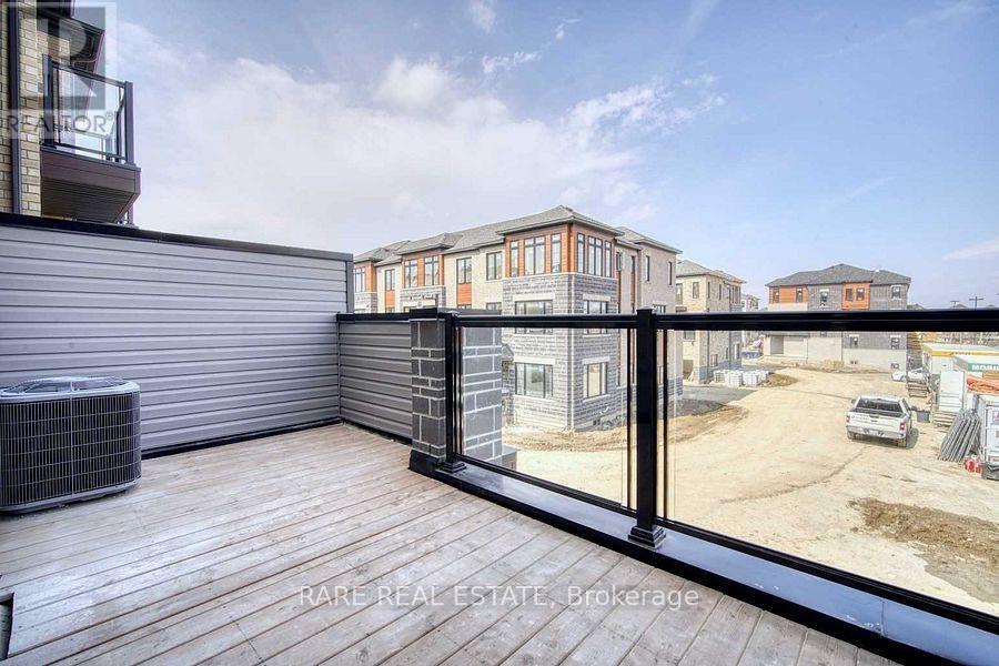 A balcony with a view of a construction site and buildings.