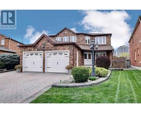A house with a brick facade and a white garage door is for sale.