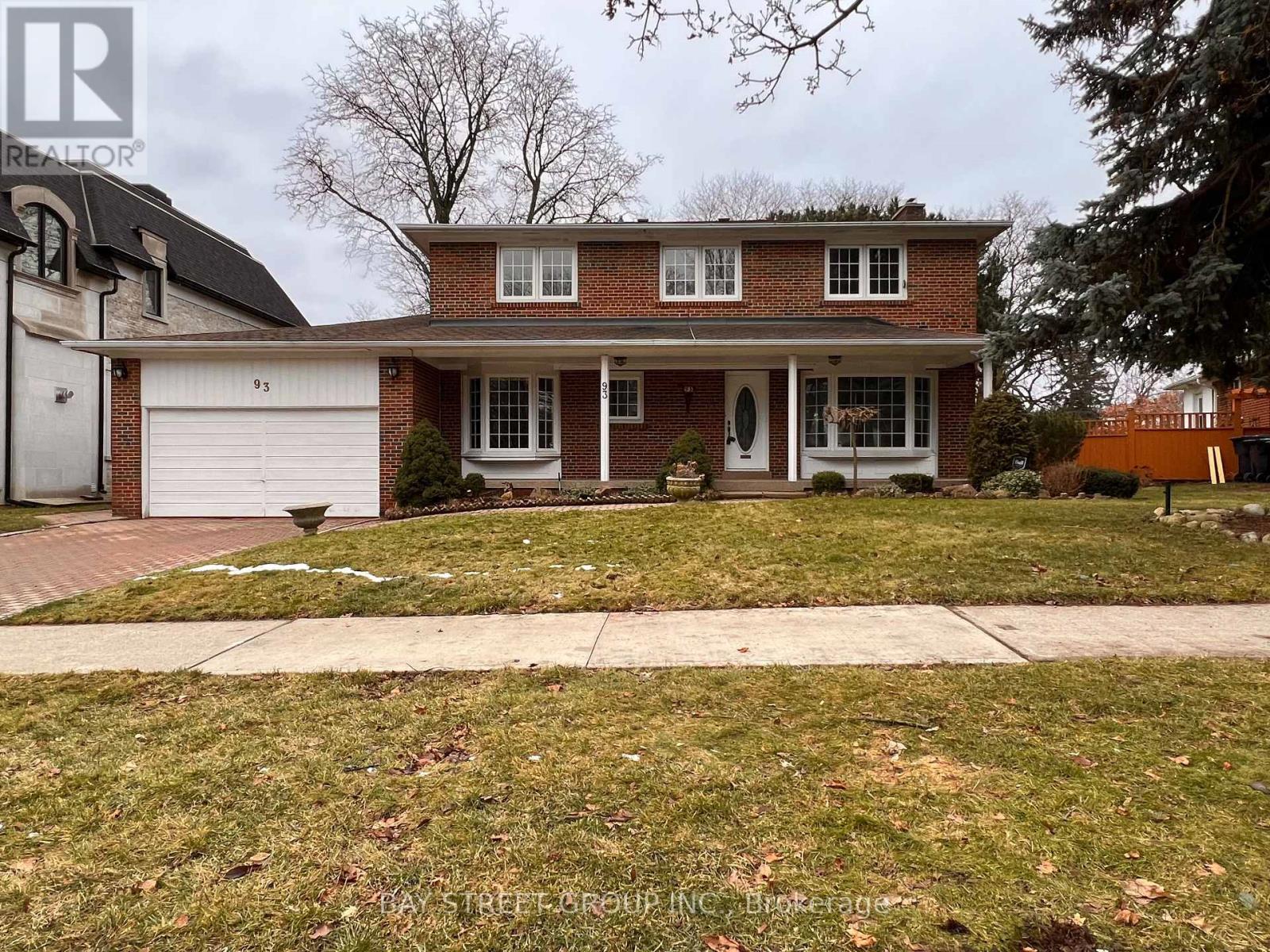 A house with a white garage door is for sale.