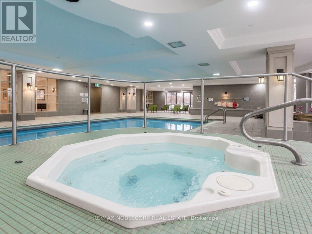 A hot tub in a room with a blue ceiling.