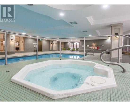 A hot tub in a room with a blue ceiling.