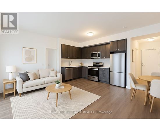 A modern kitchen with dark brown cabinets and stainless steel appliances.