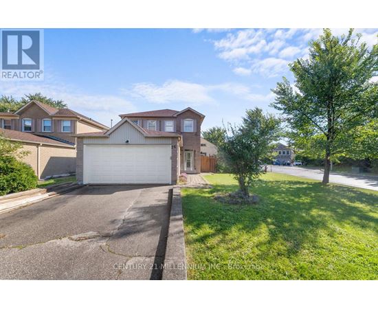 A realtor photo of a house with a garage and a tree in front.