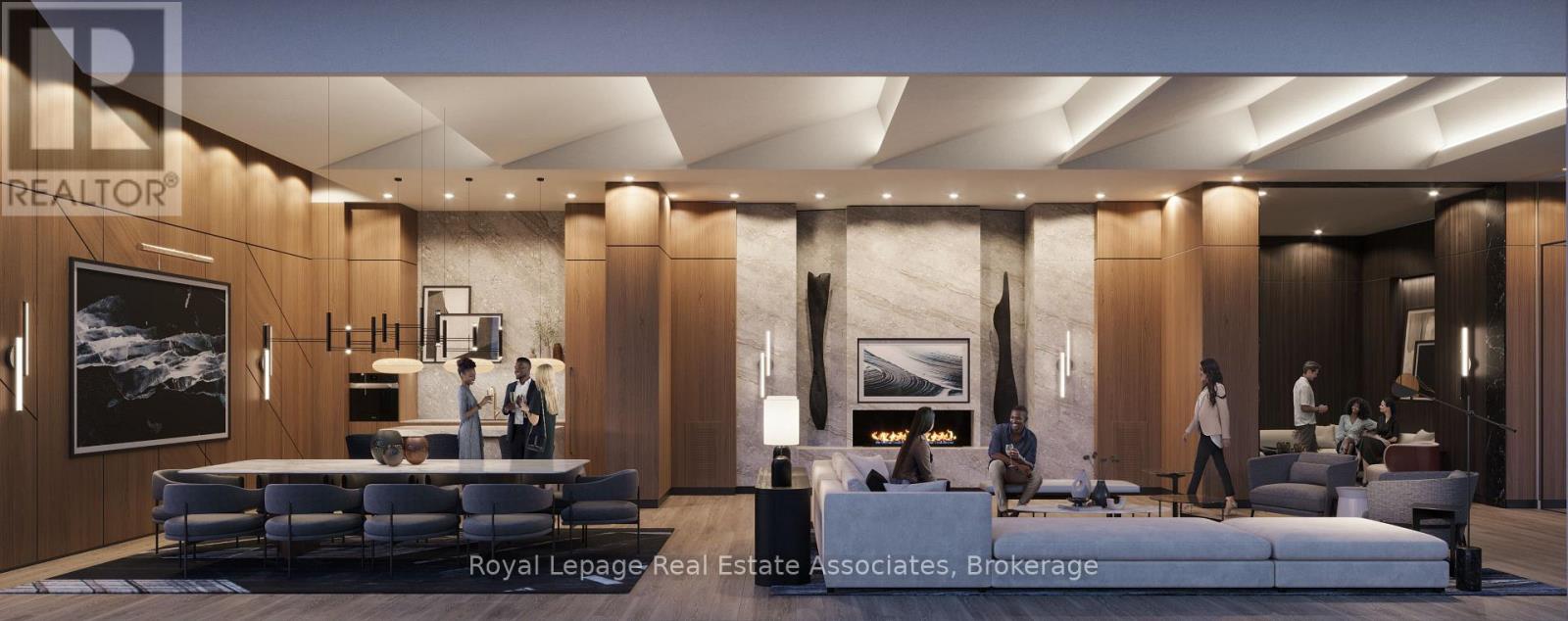 A modern living room with a large couch and a television.