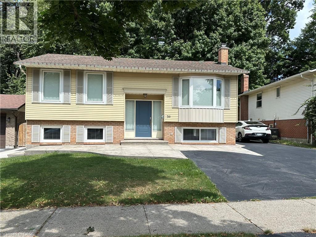 A two-story house with a blue door and white windows.