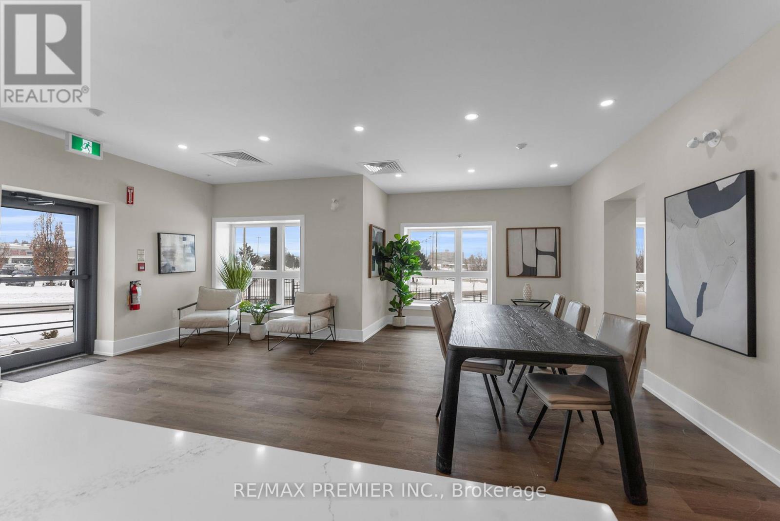 A dining room with a table set for six with a view of the outside.