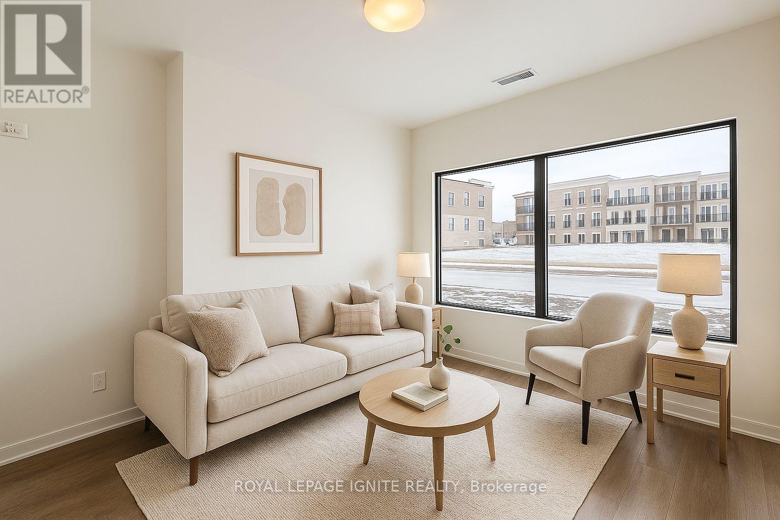 A living room with a couch, chair, and coffee table.