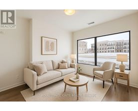 A living room with a couch, chair, and coffee table.