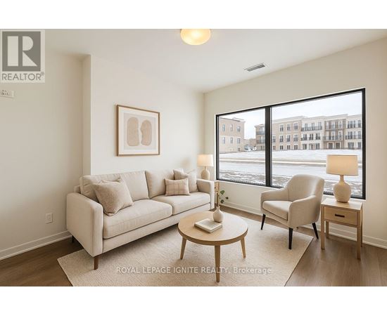 A living room with a couch, chair, and coffee table.