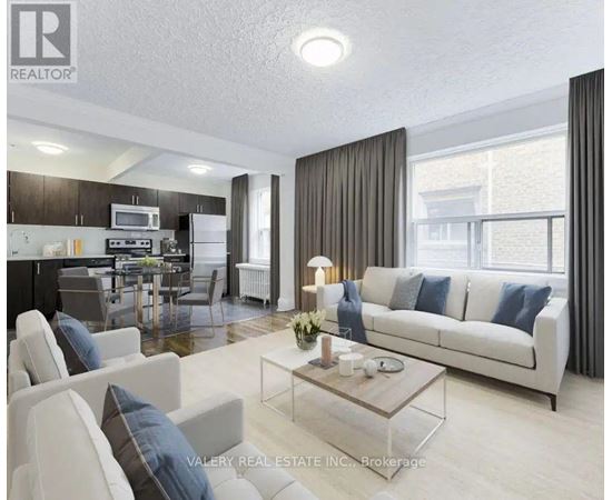 A modern living room with a white sofa and a glass coffee table.