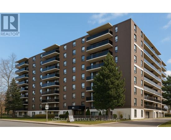 A tall apartment building with a sign that says "Valley R Estate Inc Brokerage".