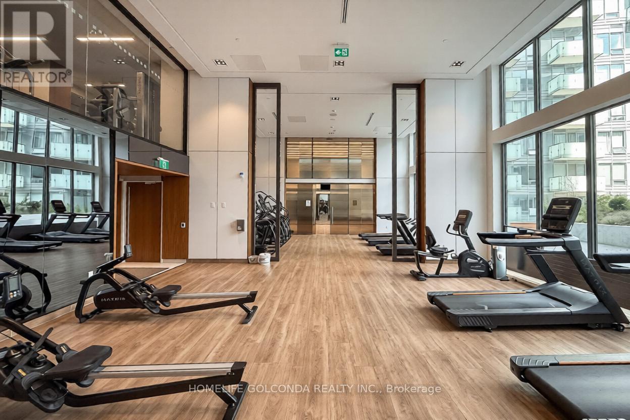 A gym with treadmills, exercise bikes and other equipment.