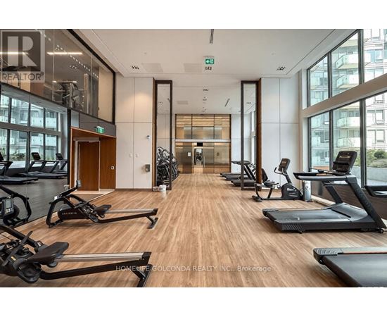 A gym with treadmills, exercise bikes and other equipment.
