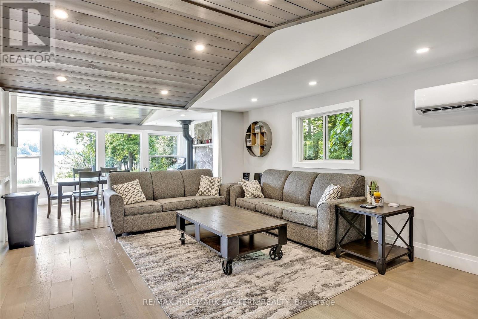 A living room with a grey sofa and a wooden coffee table.