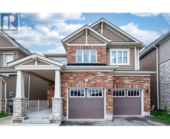 A two-story house with a garage and a brick facade.