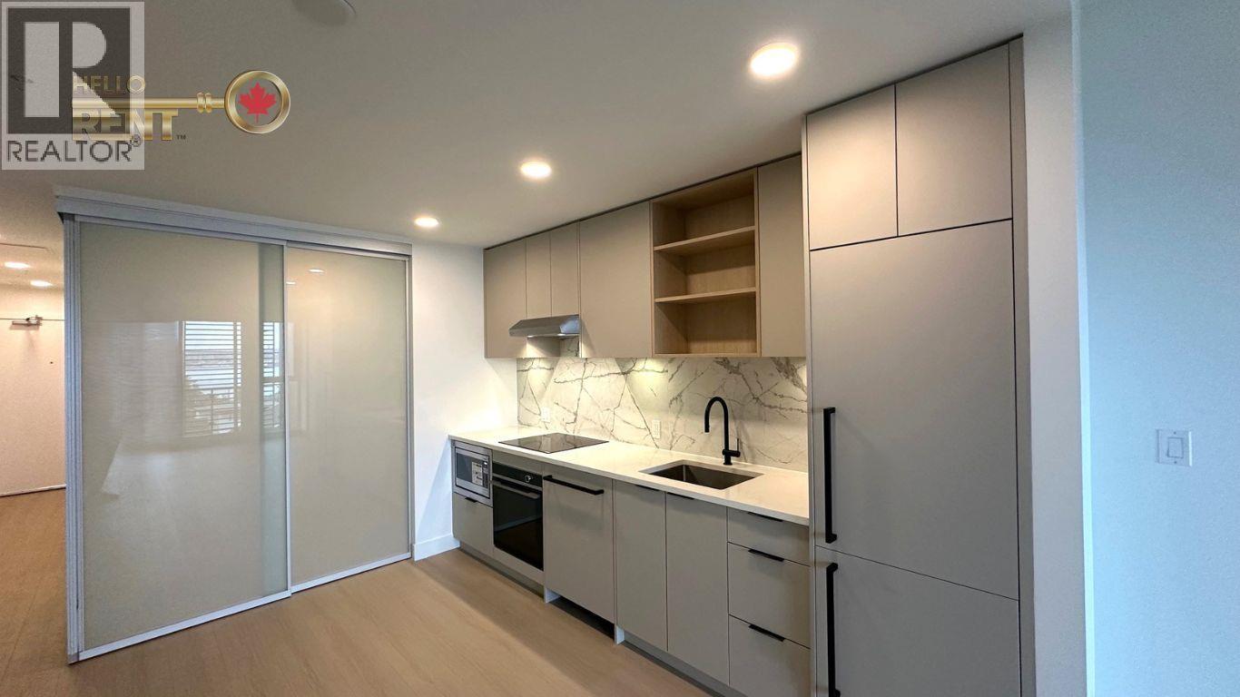 A modern kitchen with a sink and cabinets.