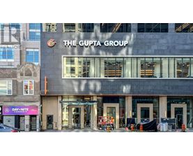 The Gupta Group building with Day Nite Cannabis sign in front.