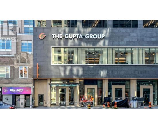 The Gupta Group building with Day Nite Cannabis sign in front.