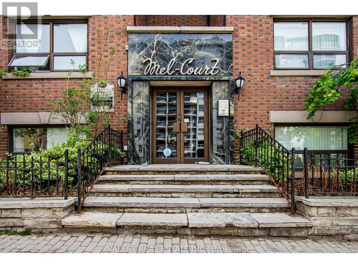 The front of a building with a sign that says "Mell Court".