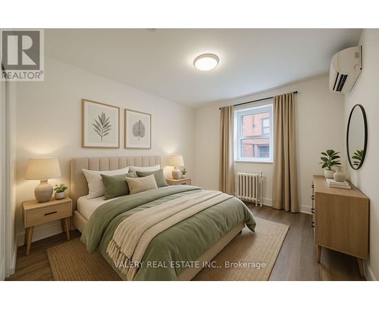 A bedroom with a bed, nightstands, and a window.