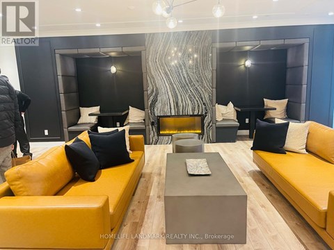 A modern living room with a yellow sofa and a grey coffee table.