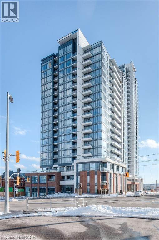 A tall building with many windows is under construction.