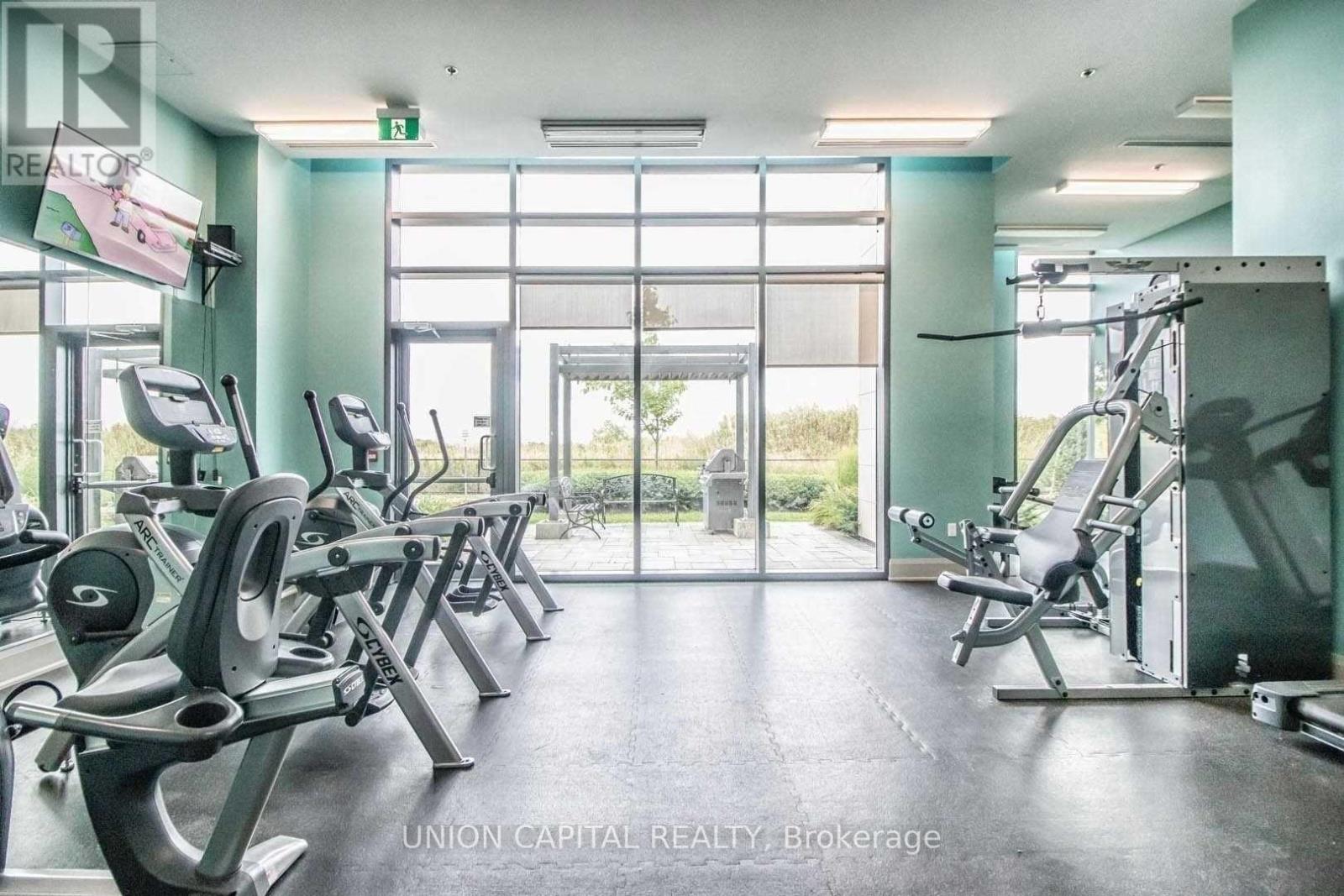 A gym with treadmills, weights and exercise machines.