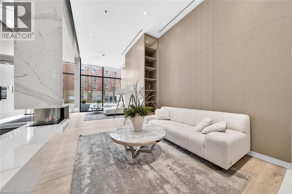 A modern living room with a white sofa and a coffee table.