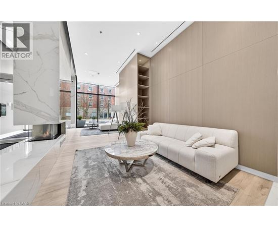 A modern living room with a white sofa and a coffee table.